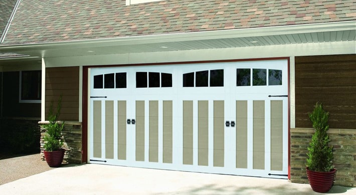 Close up of carriage house style garage doors on two-car garage door opening