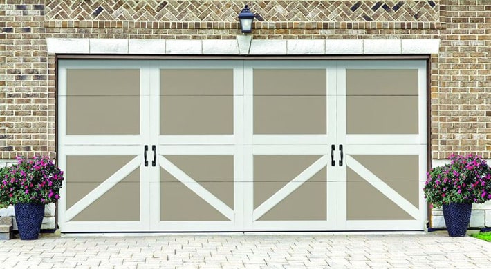 Close up photo of wide carriage house door on a two-car garage opening