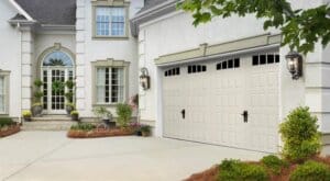 stucco house with two car garage