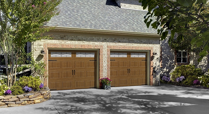 Two car garage with two garage doors with windows