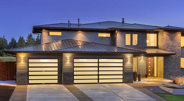 Luxury modern home with specialty garage doors