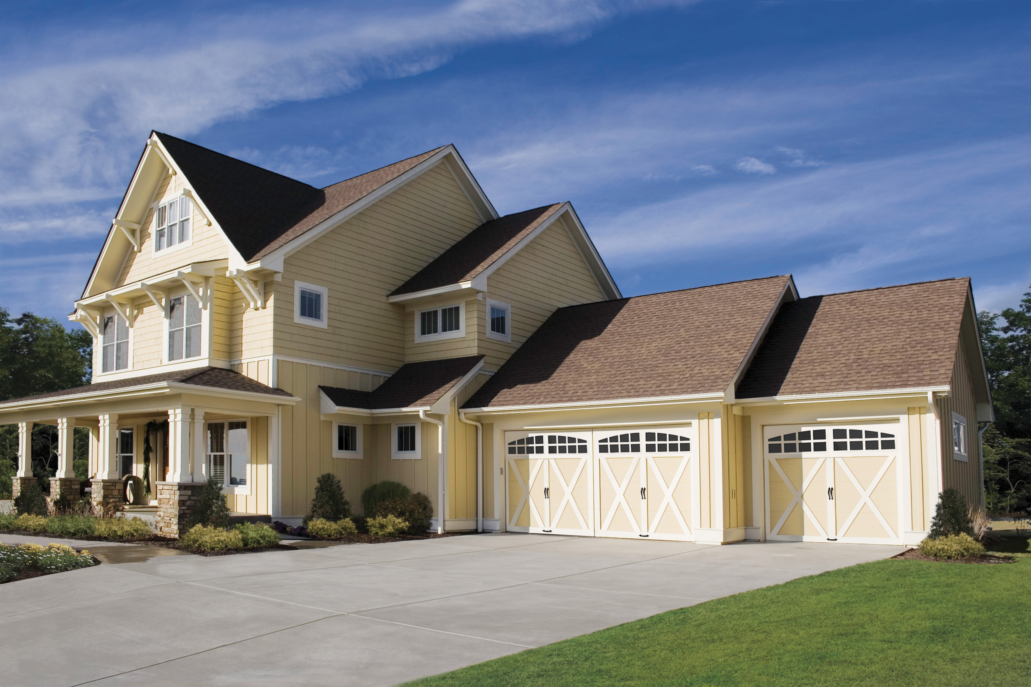 tan and white carriage style garage doors