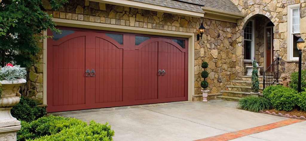Red garage doors with corner windows from Amarr garage doors. Image for Best Garage Door Brands post.
