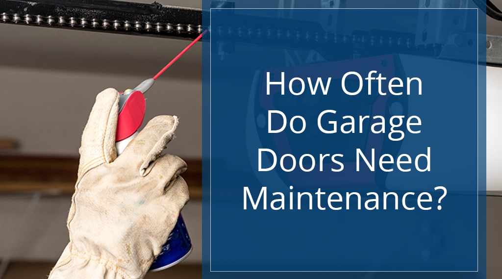 How Often Do Garage Doors Need Maintenance? Photo shows someone's hand holding a can of lubricant spray near garage door opener chain.