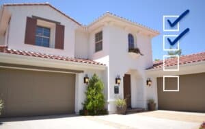 Spanish style home with check mark overlay. Cover image for blog post, How to Hire a Garage Door Company.